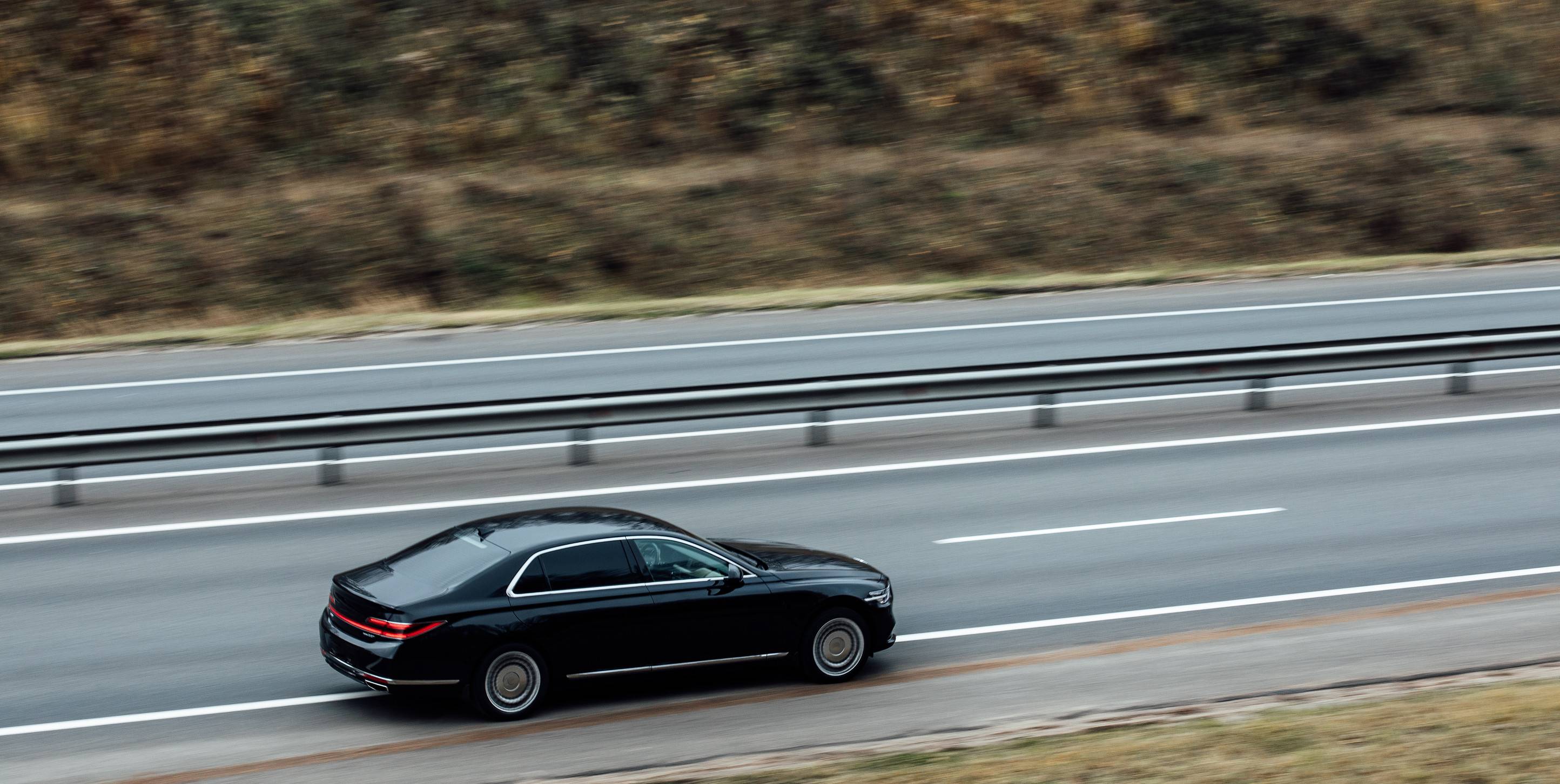 Black Sedan Speeding On The Road