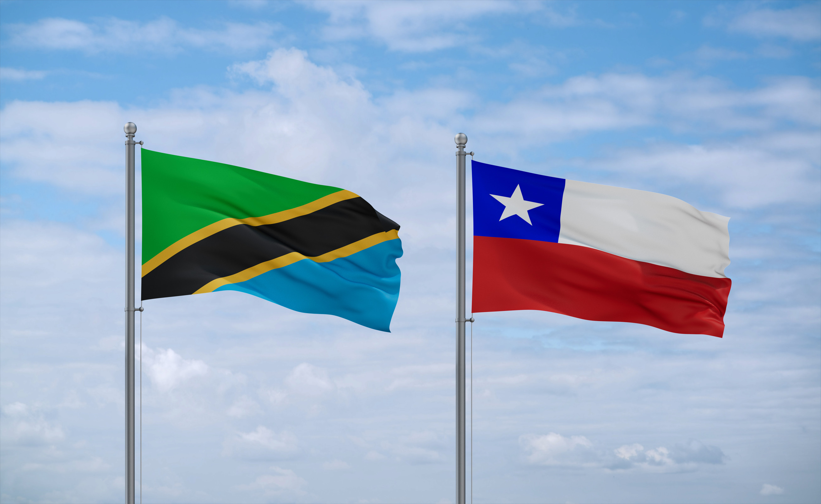 Chile And Tanzania Flags Waving Together On Blue Cloudy Sky