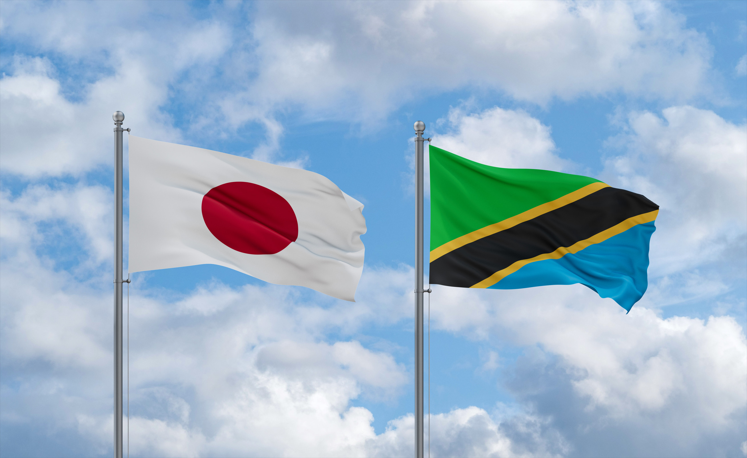 Tanzania And Japan Flags Waving