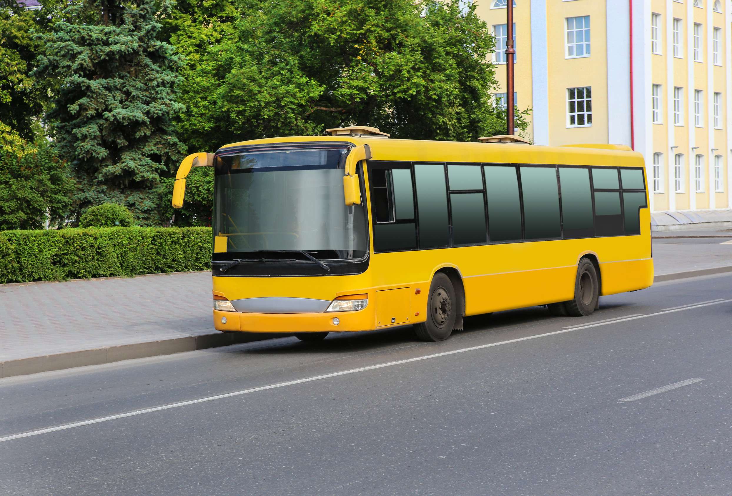 Yellow Bus Waiting On A Street